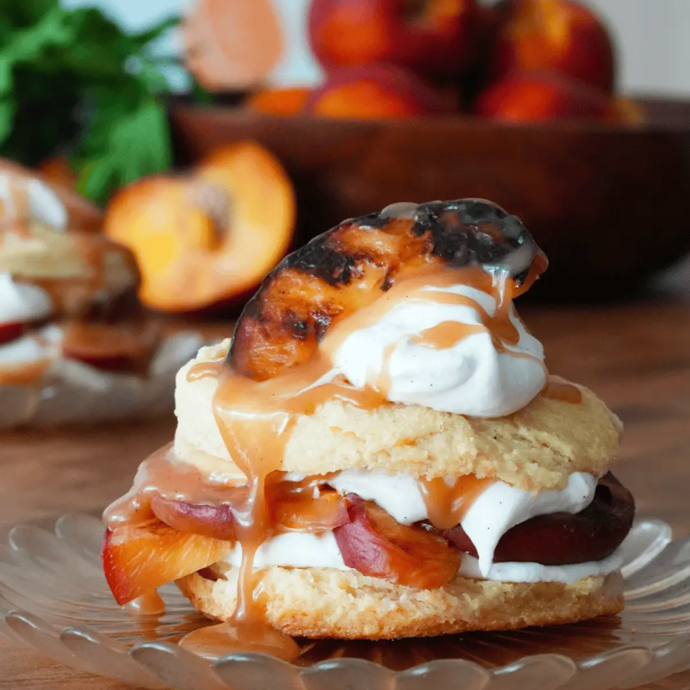 Grilled Peach Cornmeal Shortcakes with Cinnamon Caramel Bourbon Whipped Cream
